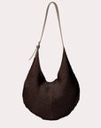 Dark brown knitted crossbody handbag against a white background.