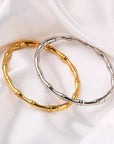 silver and gold Bamboo bangles with hinged openings