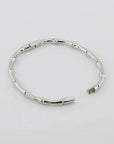 A silver bamboo bangle bracelet with a hinged opening,