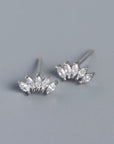 Pair of silver sparkle stud earrings with clear gemstones.