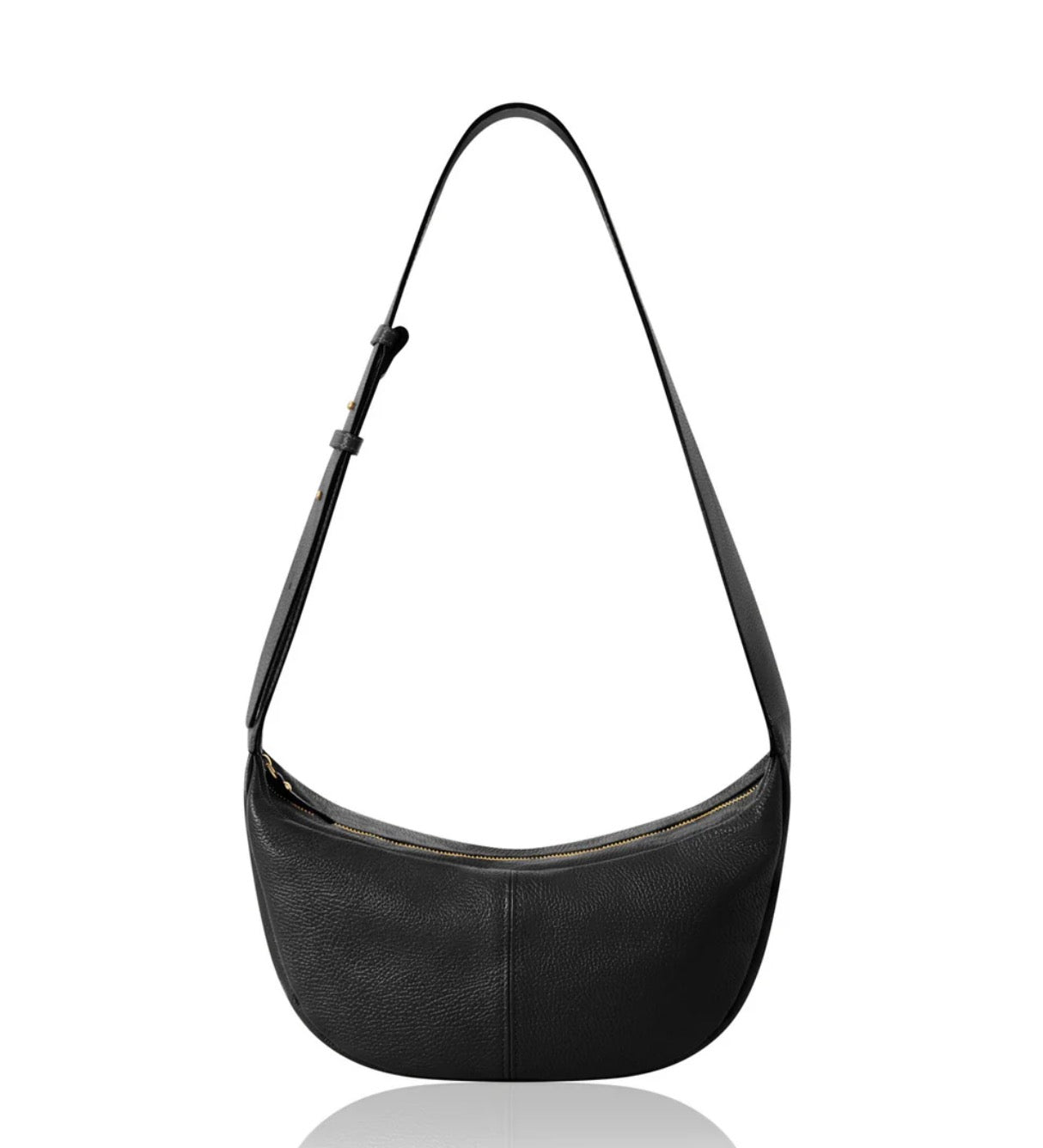 Black crossbody wide strap handbag on a white background.