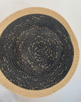 Round woven hat with black center and beige border 
