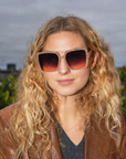 image of woman wearing square framed sunglasses 