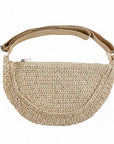 cream raffia crossbody handbag with a strap on a white background