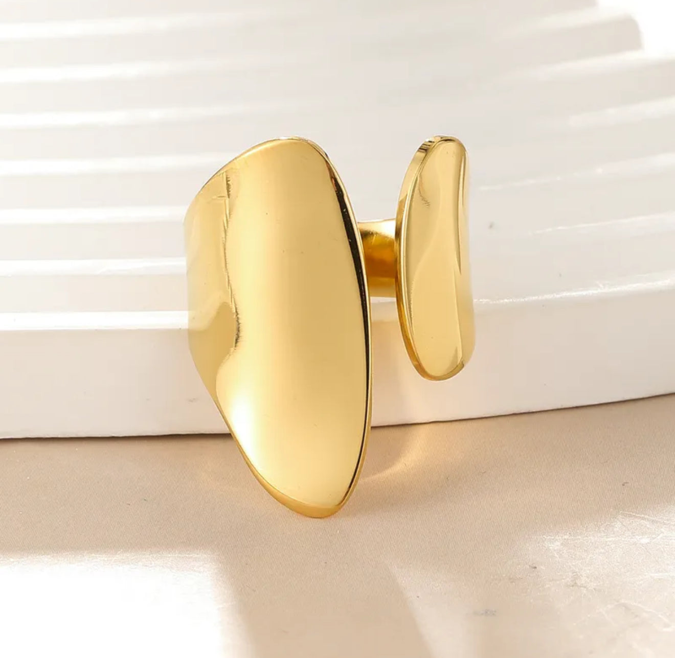 gold chunky adjustable ring on a white background 
