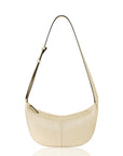 Gold crossbody handbag with a strap on a white background.