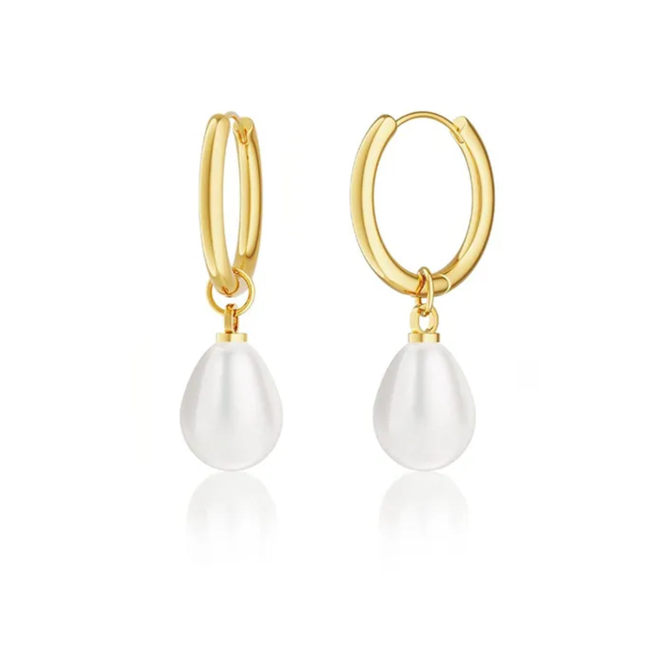 Gold hoop earrings with white teardrop-shaped pearls on a white background