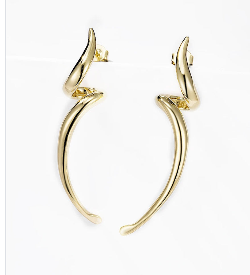 Gold twisted bolt drop  earrings on a white background