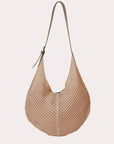 natural woven handbag with a strap on a white background