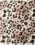 Leopard print fabric with a light background