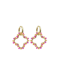 Gold hoop earrings with pink and orange beads on a white background. 