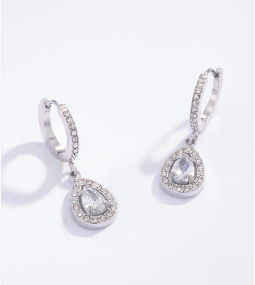 Pair of silver teardrop earrings on a white background