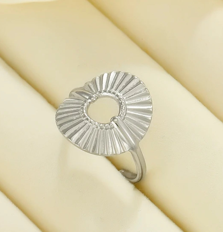 Ladies silver adjustable ring with a textured design 