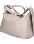 taupe crossbody handbag with a strap on a white background