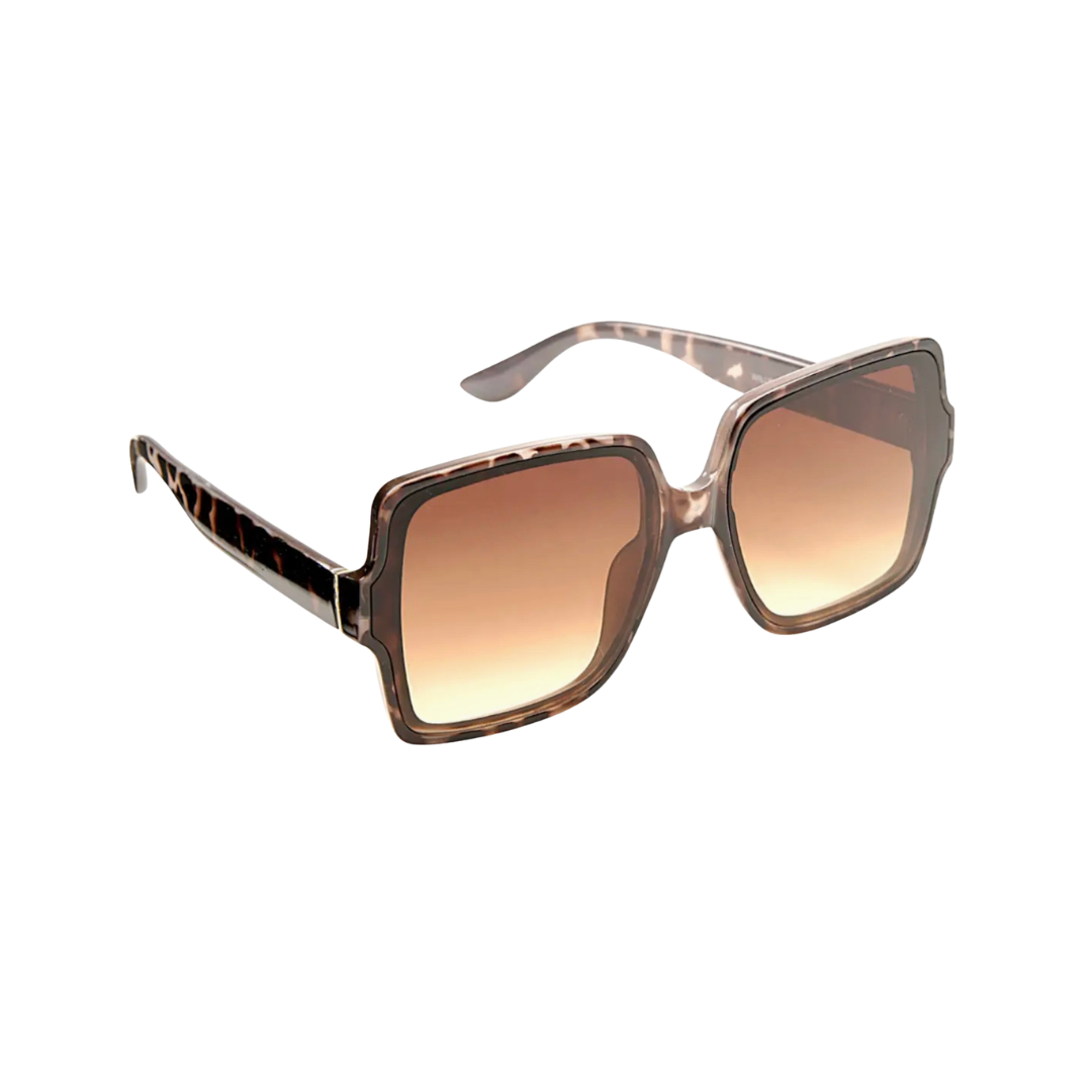 ladies tortoiseshell Sunglasses with a gradient brown lens on a white background