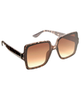 ladies tortoiseshell Sunglasses with a gradient brown lens on a white background
