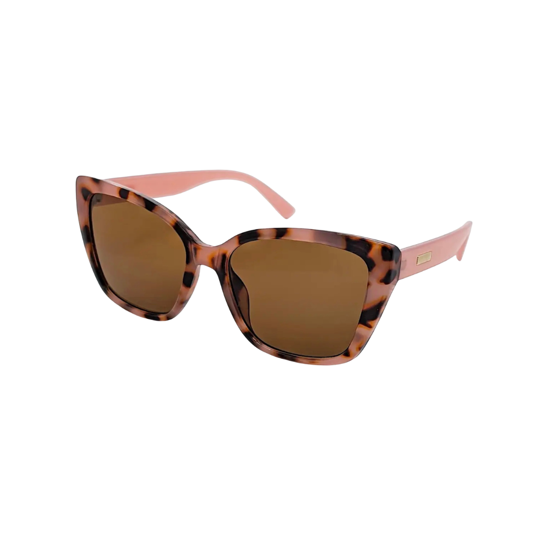 Sunglasses with pink tortoiseshell frame and pink arms on a white background for women